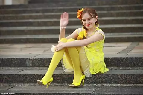 AI Video from prompt: she moves her legs to turn to face the viewer an