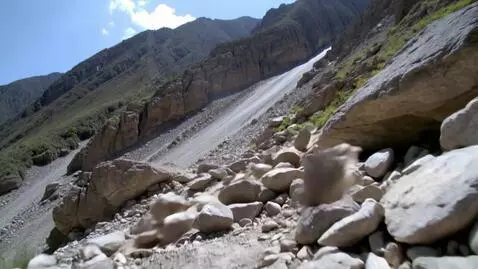 AI Video from prompt: Dodging boulders coming down a mountain