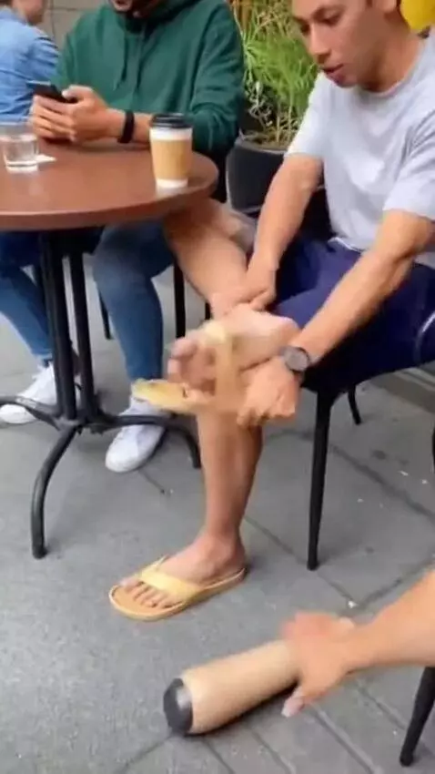 AI Video from prompt: A funny casual moment at a small outdoor café fi