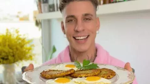 AI Video from prompt: In a cozy, well-lit kitchen, a charming man with