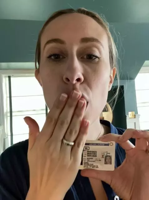 AI Video from prompt: she blows a kiss at the viewer while holding her