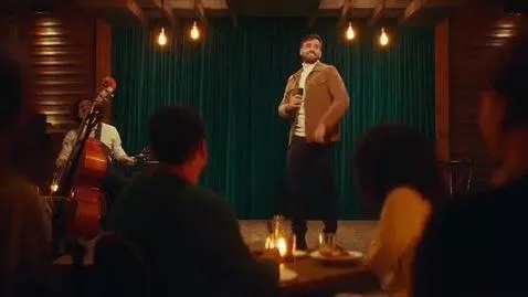 AI Video from prompt: this guy is dancing on stage in a restaurant and