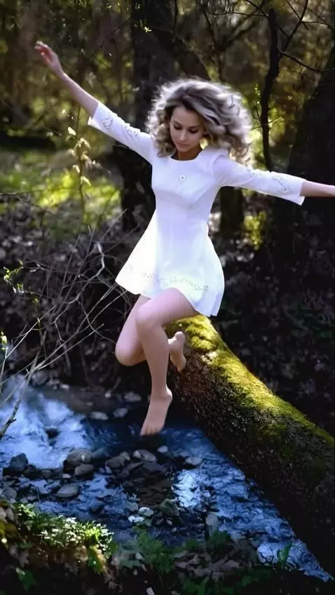 AI Video from prompt: A girl jumps from a log into the water and catch