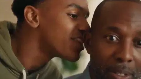 AI Video from prompt: (Scene opens with TM who is black leaning over, 