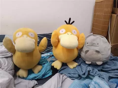 AI Video from prompt: three cute plush toys dancing on a bed, funny da