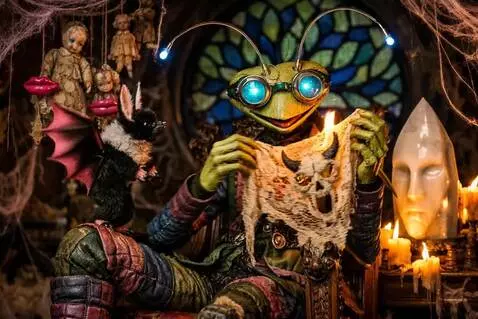 AI Video from prompt: The puppet puts the lace mask on the white statu