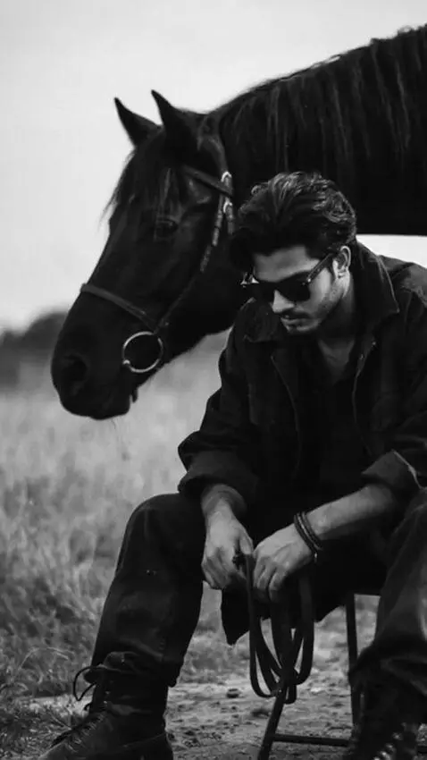 AI Video from prompt: Slow-motion black and white footage. A handsome,