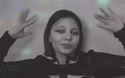 AI Video from prompt: posing, dancing, raising her arms