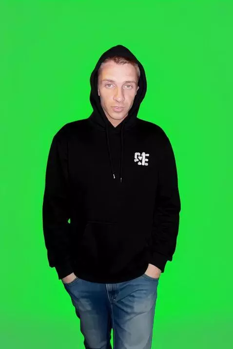 AI Video from prompt: Without taking his eyes off the camera, the youn