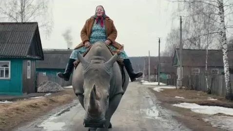 AI Video from prompt: Russian Russian grandmother rides a rhinoceros i