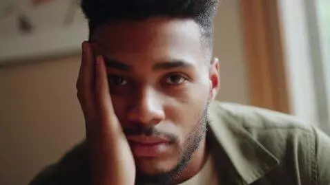 AI Video from prompt: he just looks at the camera, and the camera move