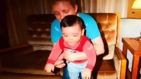 AI Video from prompt: grandmother and grandson stand up