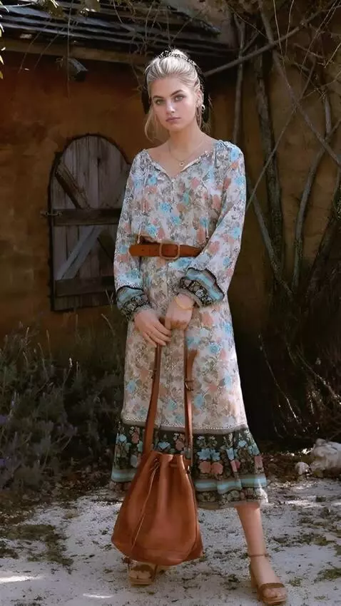 AI Video from prompt: a woman holds a large axe in her hands