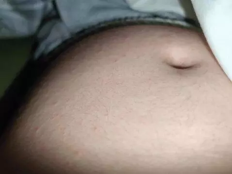 AI Video from prompt: Make this belly Churn and move around. Make the 