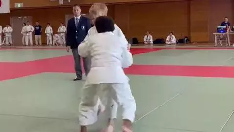AI Video from prompt: two boys in white judo jackets,white obis,croppe