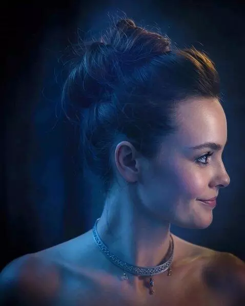 AI Video from prompt: the girl looks to the side. then an almost imper