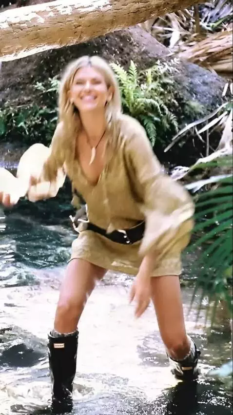 AI Video from prompt: The woman quickly catches a large wriggling  cat