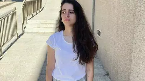 AI Video from prompt: Duration: 6 seconds.  A realistic woman standing