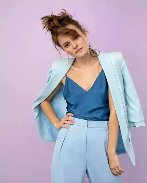 AI Video from prompt: the girl stops biting her lip, straightens her h