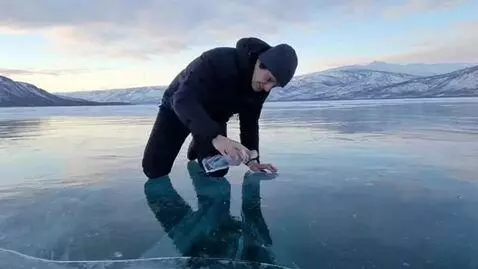 AI Video from prompt: a guy licks a water bottle and then ends up on t