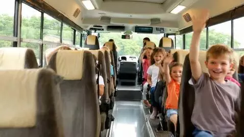 AI Video from prompt: Bunny driving bus forward, wheels moving fast, h