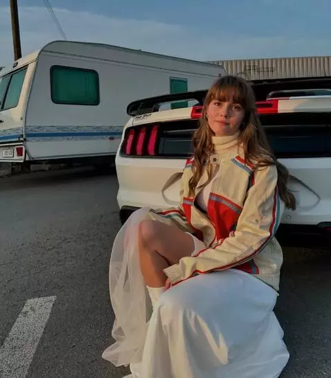 AI Video from prompt: the girl is pointing her index finger directly a