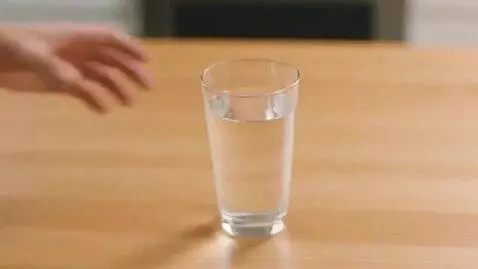 AI Video from prompt: Scene 1: A woman approaches a kitchen table with