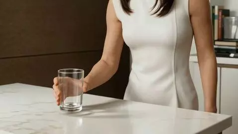 AI Video from prompt: Scene 1: A woman approaches a kitchen table with