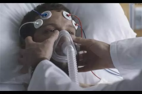 AI Video from prompt: The patient takes long deep breaths as the docto