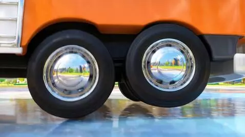 AI Video from prompt: close-up of big round bus wheels spinning, shiny