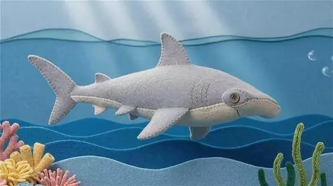 AI Video from prompt: 3D sewn-felt stop-motion style. The Hammerhead s