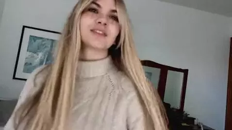 AI Video from prompt: Stand up and turn around in skirt