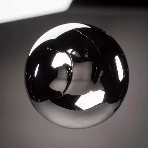 AI Video from prompt: “The chrome sphere slowly starts rippling like l