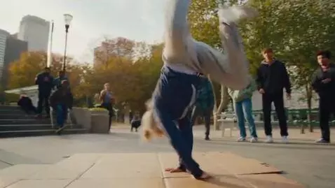 AI Video from prompt: grandmother doing backflip with breakdance