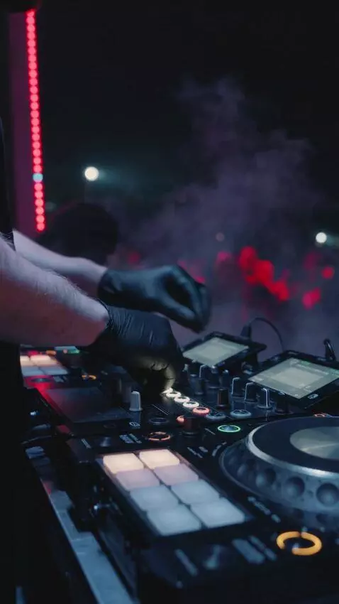 AI Video from prompt: Night DJ performance, dark club atmosphere, RGB 