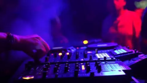 AI Video from prompt: Night DJ performance, dark club atmosphere, RGB 