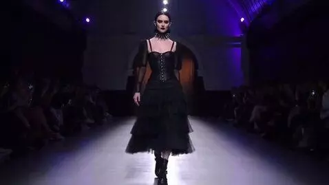 AI Video from prompt: a model walks down the runway in a gothic dress