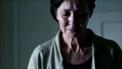 AI Video from prompt: Mature woman with short dark hair is standing wi