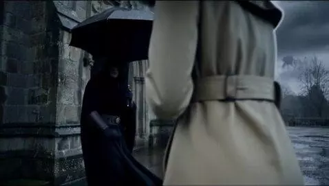 AI Video from prompt: the girl stands in the rain she looks down in sh