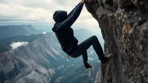 AI Video from prompt: The guy is hanging by the edge of the cliff, try