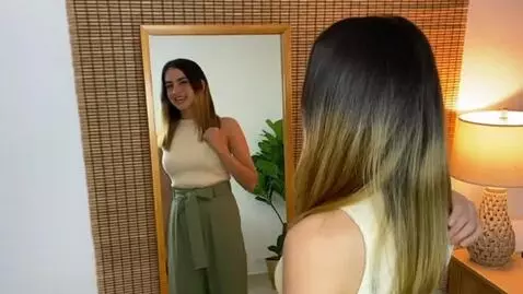 AI Video from prompt: make the breast grow  while she s touching them