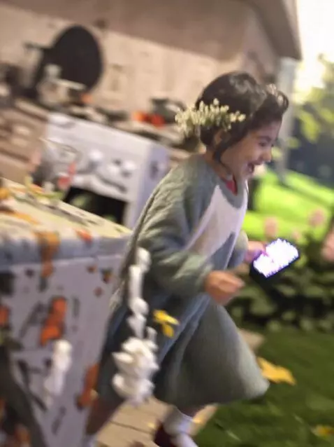 AI Video from prompt: A 5-year-old girl in a light blue dress with whi