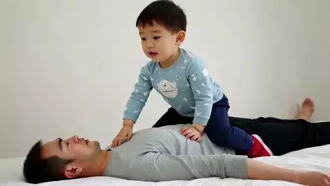 AI Video from prompt: skinny cute boy riding on lying man