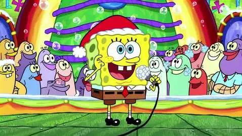 AI Video from prompt: SpongeBob with a Santa hat holds the microphone 