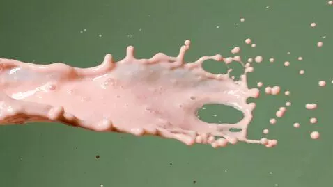 AI Video from prompt: Generate a video of a pink yoghurt splash from t