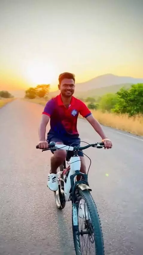 AI Video from prompt: A man riding a bicycle smoothly on a scenic road