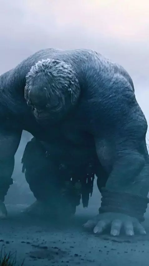 AI Video from prompt: The giant gets on her knees, lies down on her st