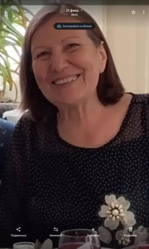 AI Video from prompt: This woman will smile and wave her hand.