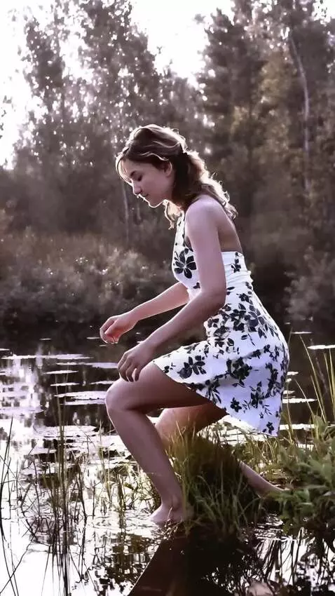 AI Video from prompt: The girl gets on her knees and lies down on her 