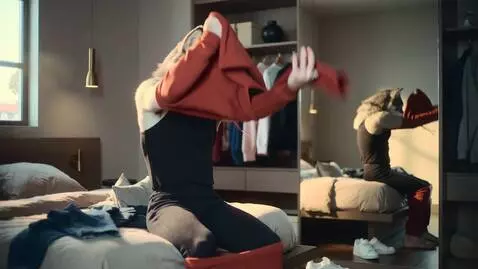 AI Video from prompt: anhthro wolf putting on a streetwear outfit in a